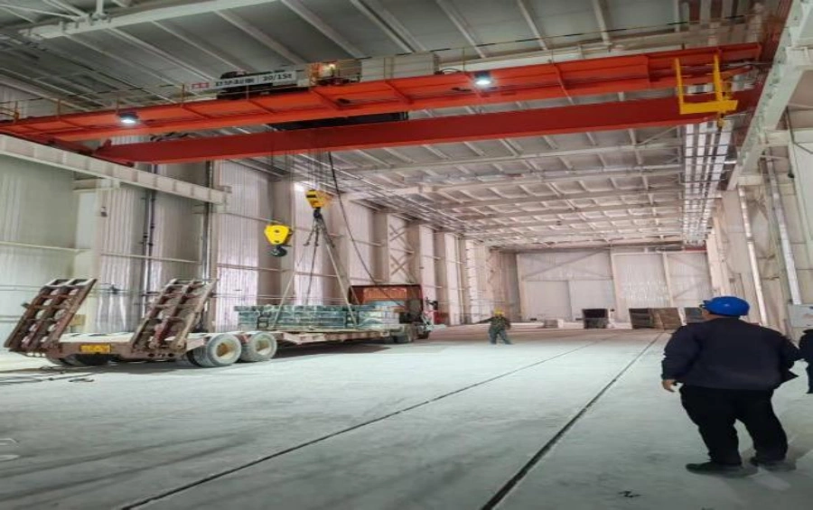 Heavy-duty overhead crane assembly in industrial steel workshop.webp